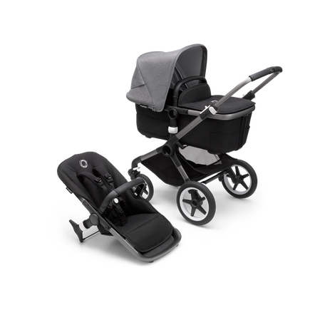 Bugaboo Fox 3 carrycot and seat pushchair with graphite frame, black fabrics, and grey sun canopy.
