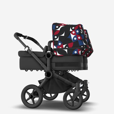 Bugaboo Donkey 5 Twin bassinet and seat stroller black base, midnight black fabrics, animal explorer red/blue sun canopy
