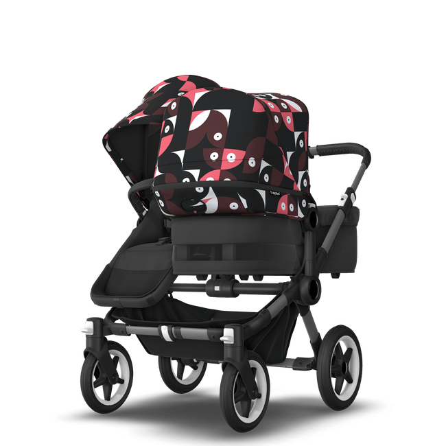 Bugaboo Donkey 5 Duo bassinet and seat stroller graphite base, midnight black fabrics, animal explorer pink/ red sun canopy