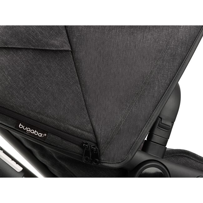Close up on the side of a Fox 3 mineral washed black sun canopy with the Bugaboo logo tag. - Main Image Slide 10 of 15