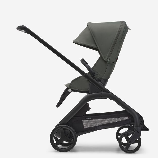 Side view of the Bugaboo Dragonfly seat stroller with black chassis, forest green fabrics and forest green sun canopy. - Main Image Slide 2 of 16