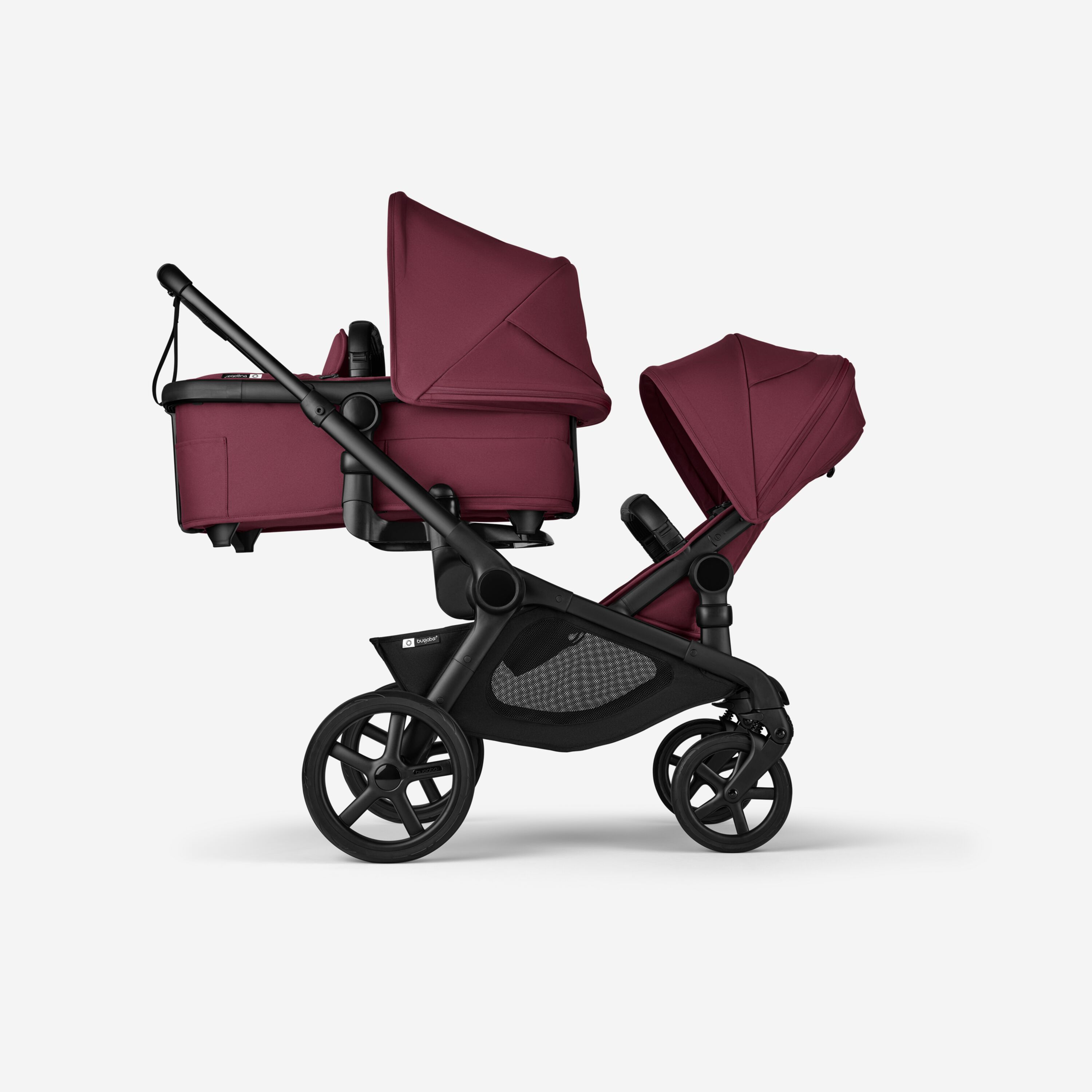 Bugaboo Kangaroo 2-in-1 tandem stroller with one bassinet above and one seat below, with Dark Cherry fabrics and Dark Cherry sun canopies. - Main Modal Image Slide 2 of 18