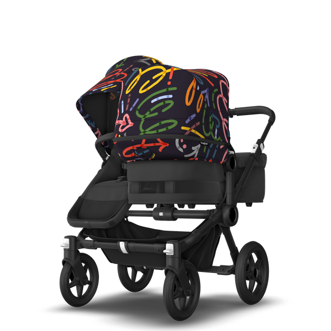 Bugaboo Donkey 5 Duo bassinet and seat stroller black base, midnight black fabrics, art of discovery dark blue sun canopy