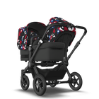 Bugaboo Donkey 5 Duo bassinet and seat stroller black base, midnight black fabrics, animal explorer red/ blue sun canopy