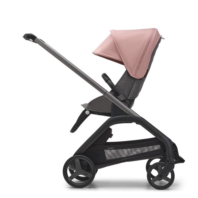 Side view of the Bugaboo Dragonfly seat stroller with graphite chassis, grey melange fabrics and morning pink sun canopy.
