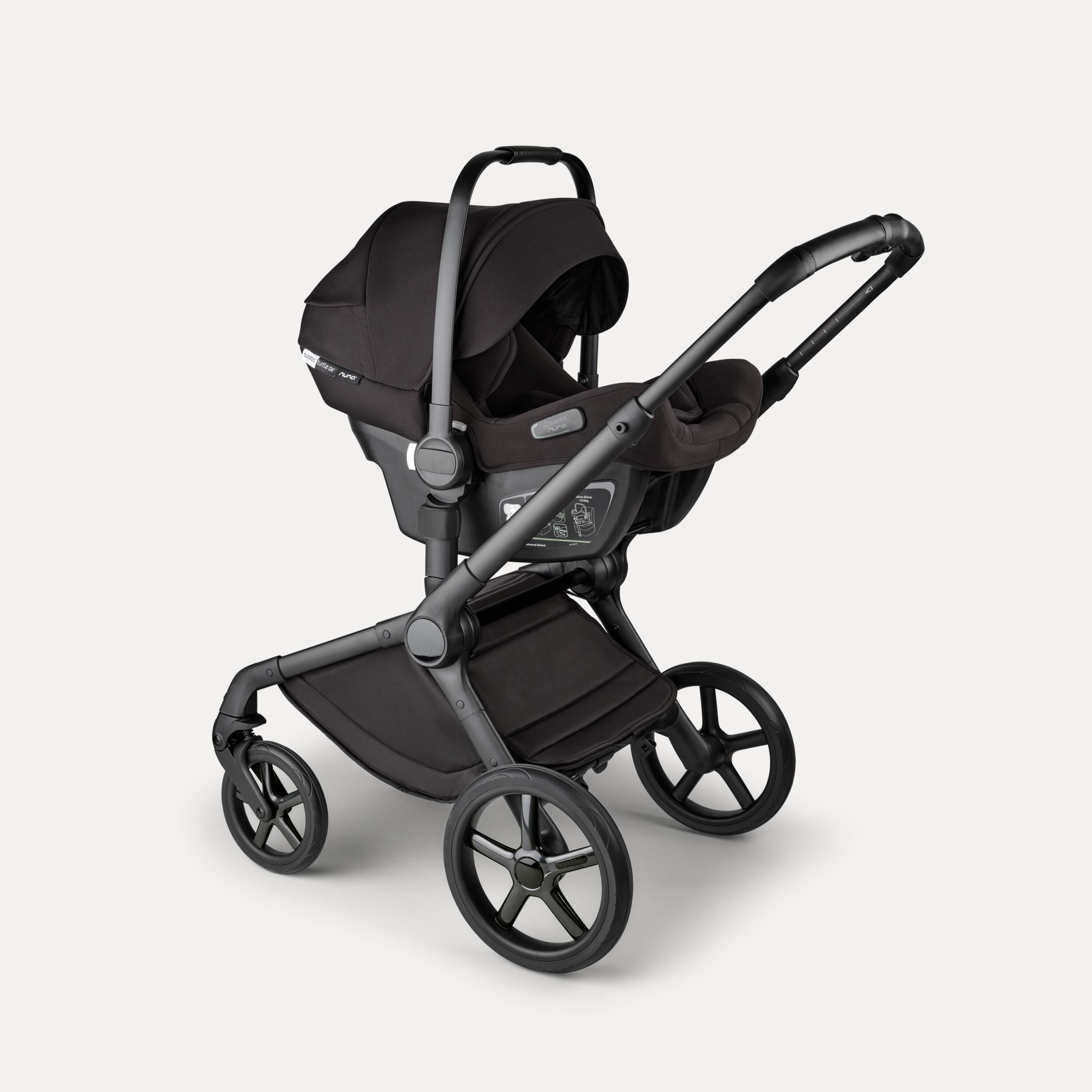 A Bugaboo Fox 5 Noir Limited Edition stroller with a Bugaboo Turtle Air by Nuna car seat. - Main Modal Image Slide 14 of 15