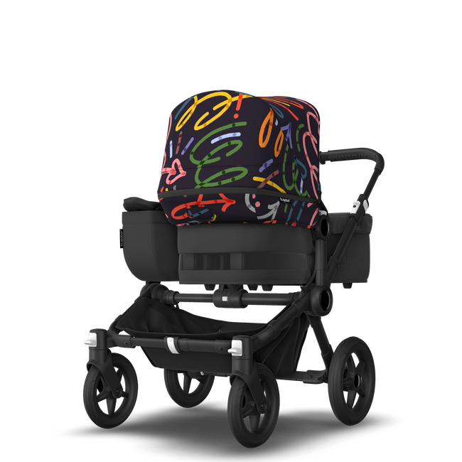 Bugaboo Donkey 5 Mono bassinet and seat stroller black base, midnight black fabrics, art of discovery dark blue sun canopy