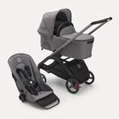 Bugaboo Dragonfly bassinet and seat pram with graphite chassis, grey melange fabrics and grey melange sun canopy.