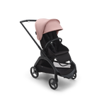 Bugaboo Dragonfly seat stroller with black chassis, midnight black fabrics and morning pink sun canopy.