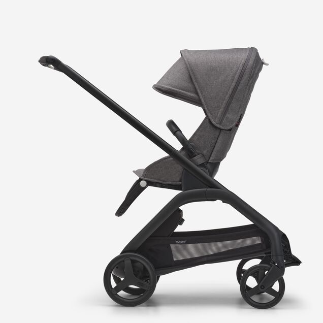 Side view of the Bugaboo Dragonfly seat stroller with black chassis, grey melange fabrics and grey melange sun canopy. - Main Image Slide 2 of 16