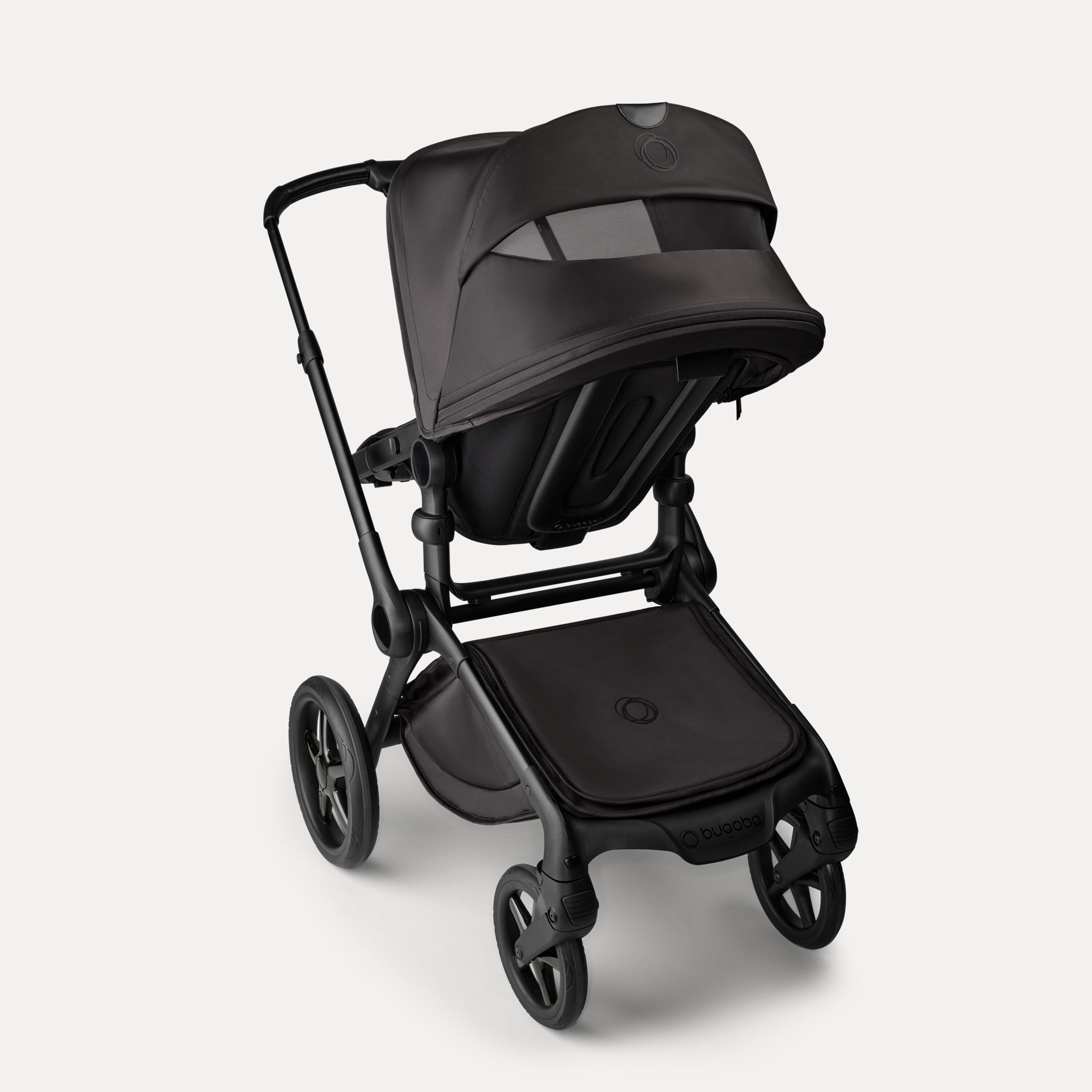 Back view of the Bugaboo Fox 5 Noir Limited Edition stroller in Black Moonlight, with the sun canopy's peek-a-boo panel visible. - Main Modal Image Slide 5 of 15