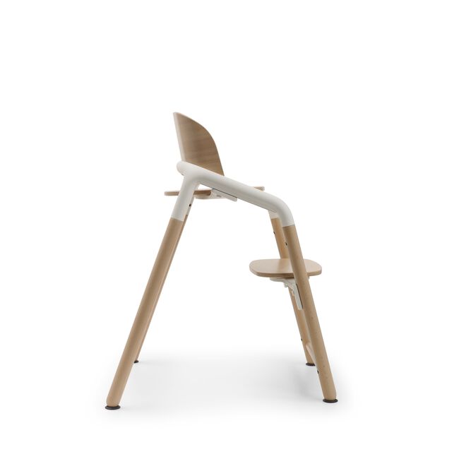 Side view of the Bugaboo Giraffe chair in neutral wood/white.