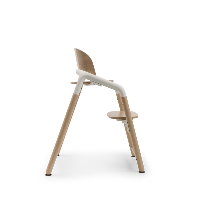 Side view of the Bugaboo Giraffe chair in neutral wood/white.