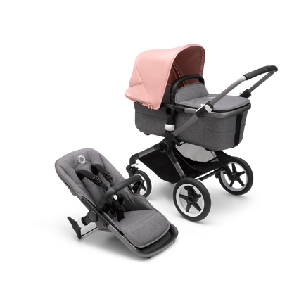 Bugaboo Fox 3 carrycot and seat pushchair with graphite frame, grey fabrics, and pink sun canopy.