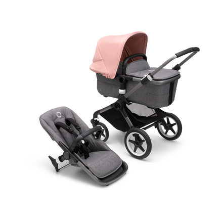 Bugaboo Fox 3 carrycot and seat pushchair with graphite frame, grey fabrics, and pink sun canopy.