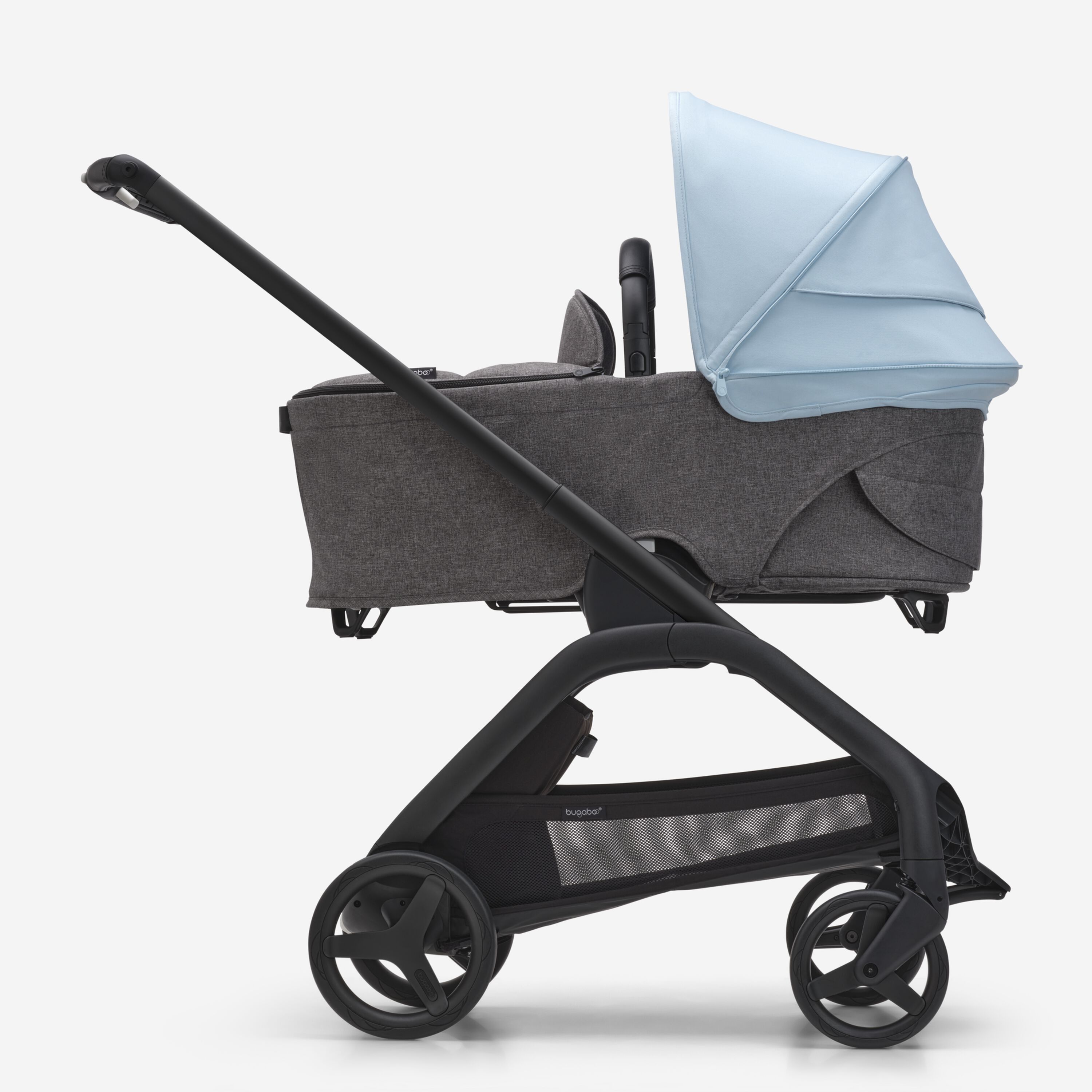 Side view of the Bugaboo Dragonfly bassinet stroller with black chassis, grey melange fabrics and skyline blue sun canopy. - Main Modal Image Slide 3 of 16