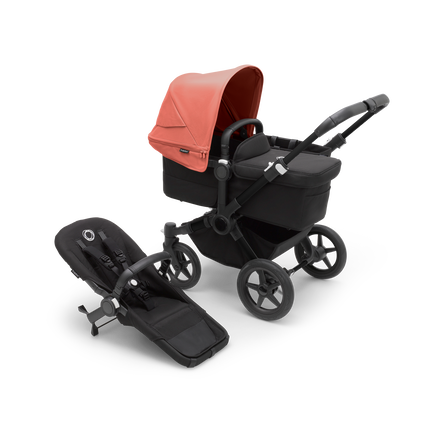 Bugaboo Donkey 5 Mono bassinet stroller with black chassis, midnight black fabrics and sunrise red sun canopy, plus seat.