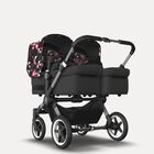 Bugaboo Donkey 5 twin stroller graphite base, midnight black fabrics, animal explorer pink/red sun canopy