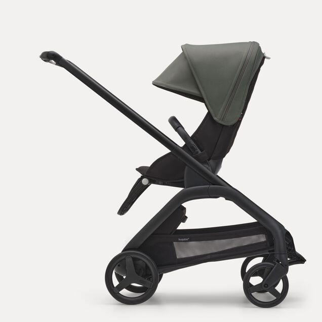 Side view of the Bugaboo Dragonfly seat stroller with black chassis, midnight black fabrics and forest green sun canopy. - Main Image Slide 2 of 16