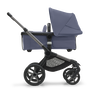 Side view of the Bugaboo Fox 5 bassinet stroller with graphite chassis, midnight black fabrics and stormy blue sun canopy. - Thumbnail Slide 2 of 14