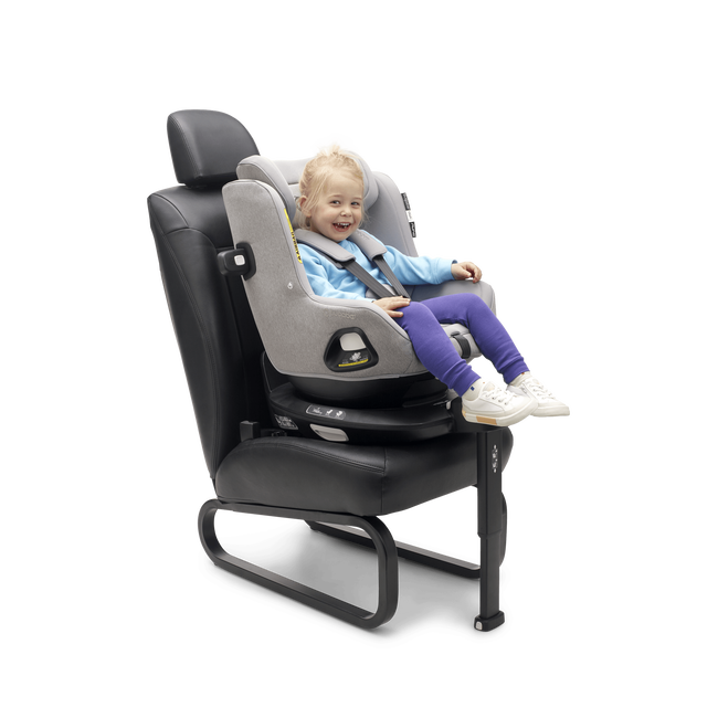 A happy toddler safely seated in the Bugaboo Owl by Nuna with 360 ISOFIX Base.