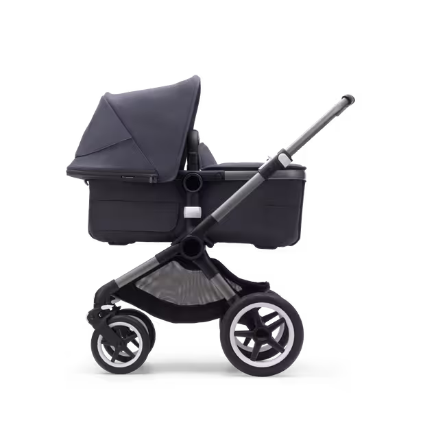 Side view of a Fox 3 bassinet stroller with graphite frame, stormy blue fabrics and stormy blue sun canopy. - Main Image Slide 5 of 9