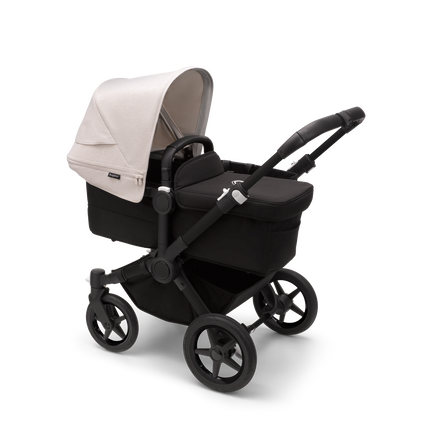 Bugaboo Donkey 5 Mono bassinet stroller with black chassis, midnight black fabrics and misty white sun canopy.