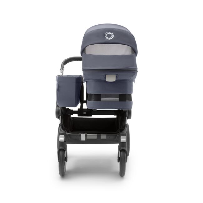 Back view of the Bugaboo Donkey 5 Mono bassinet stroller with graphite chassis, stormy blue fabrics and stormy blue sun canopy.
