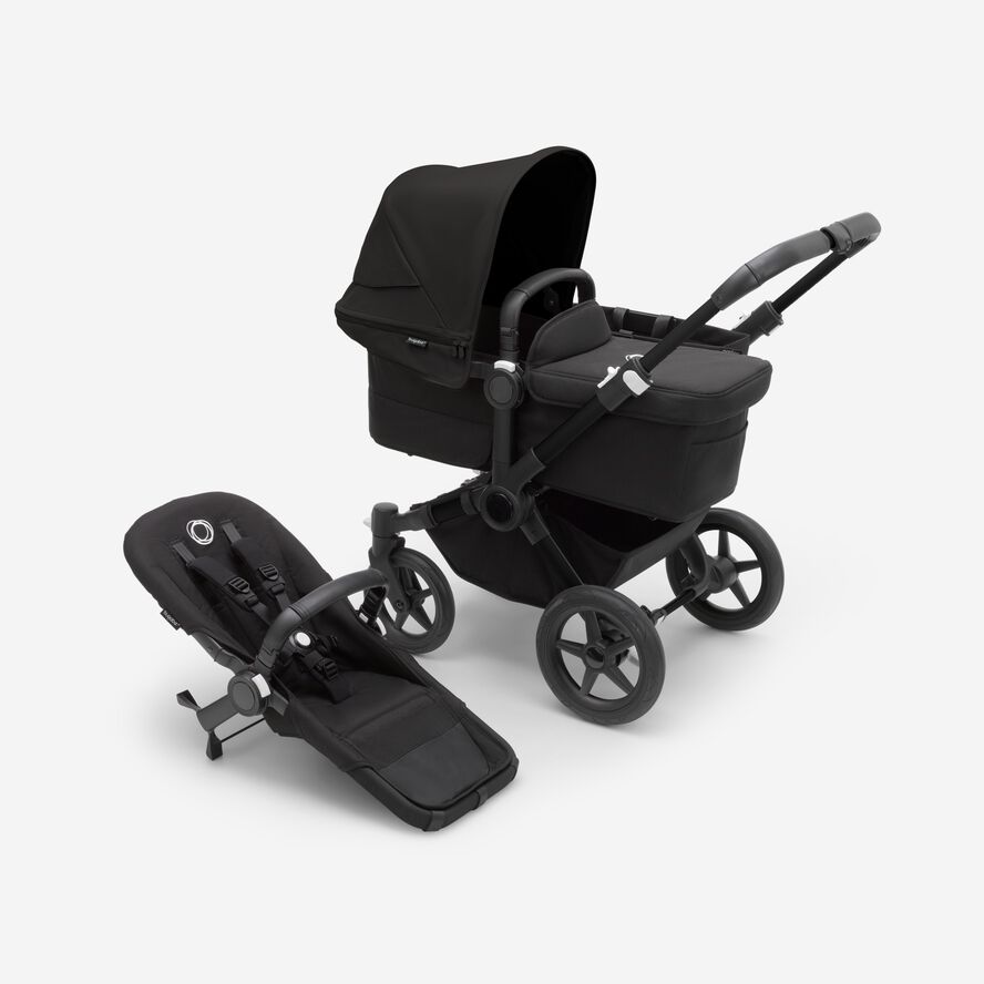 Bugaboo Donkey 5 Mono bassinet stroller with black chassis, midnight black fabrics and midnight black sun canopy, plus seat.