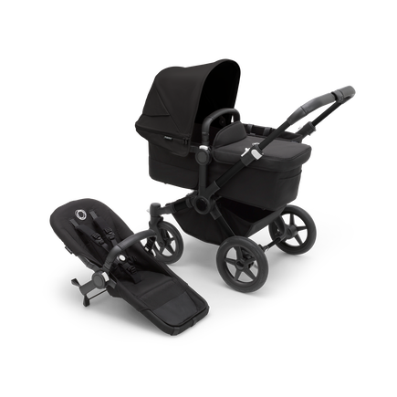 Bugaboo Donkey 5 Mono bassinet stroller with black chassis, midnight black fabrics and midnight black sun canopy, plus seat.