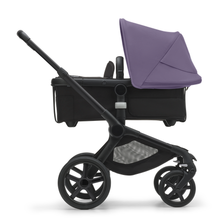 Side view of the Bugaboo Fox 5 carrycot pushchair with black chassis, midnight black fabrics and astro purple sun canopy. - view 2