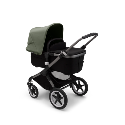 Bugaboo Fox 3 carrycot pushchair with graphite frame, black fabrics, and forest green sun canopy.