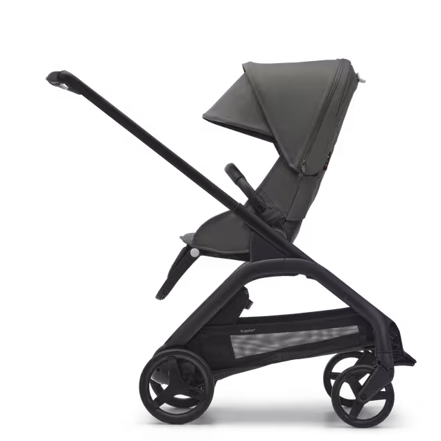 Side view of the Bugaboo Dragonfly seat pushchair with black chassis, forest green fabrics and forest green sun canopy. - Main Image Slide 2 of 16