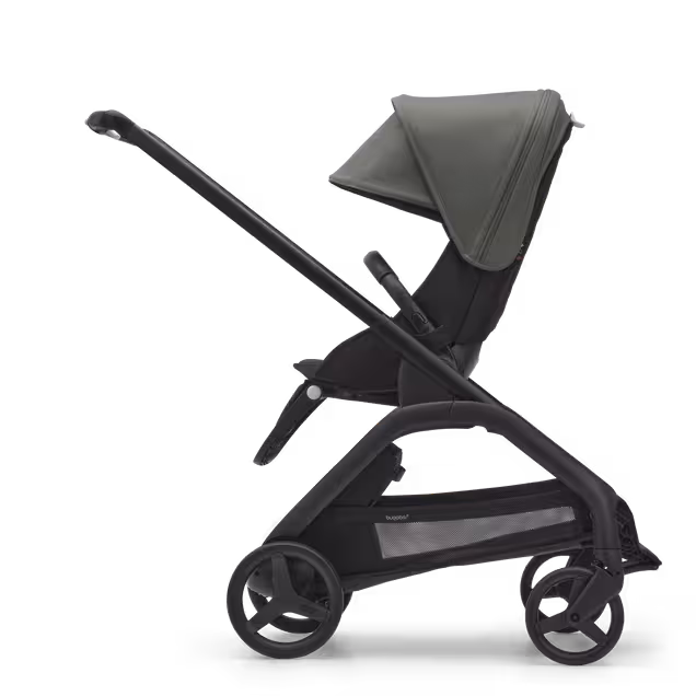 Side view of the Bugaboo Dragonfly seat stroller with black chassis, midnight black fabrics and forest green sun canopy. - Main Image Slide 2 of 16