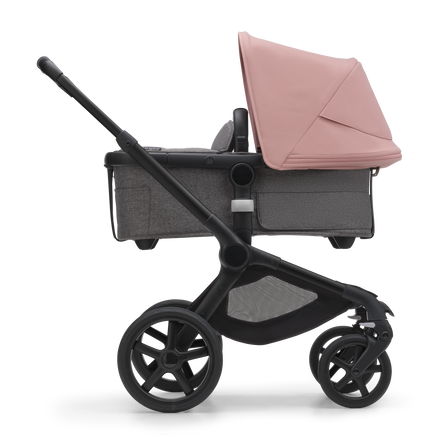 Side view of the Bugaboo Fox 5 bassinet pram with black chassis, forest green fabrics and forest green sun canopy. - view 2