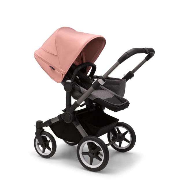 Bugaboo Donkey 5 Mono seat stroller with graphite chassis, grey melange fabrics and morning pink sun canopy.