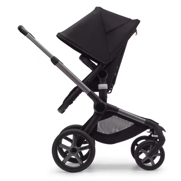 Side view of the Bugaboo Fox 5 seat stroller with graphite chassis, midnight black fabrics and midnight black sun canopy. - Main Image Slide 3 of 13