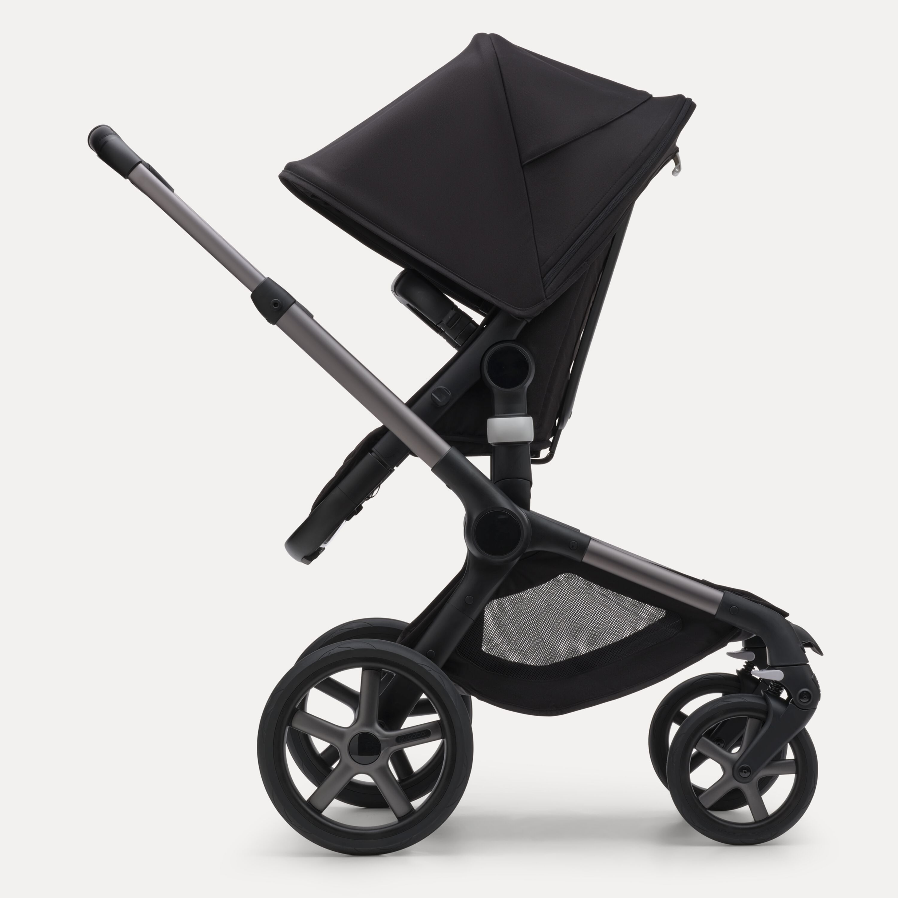 Side view of the Bugaboo Fox 5 seat stroller with graphite chassis, midnight black fabrics and midnight black sun canopy. - Main Modal Image Slide 3 of 13