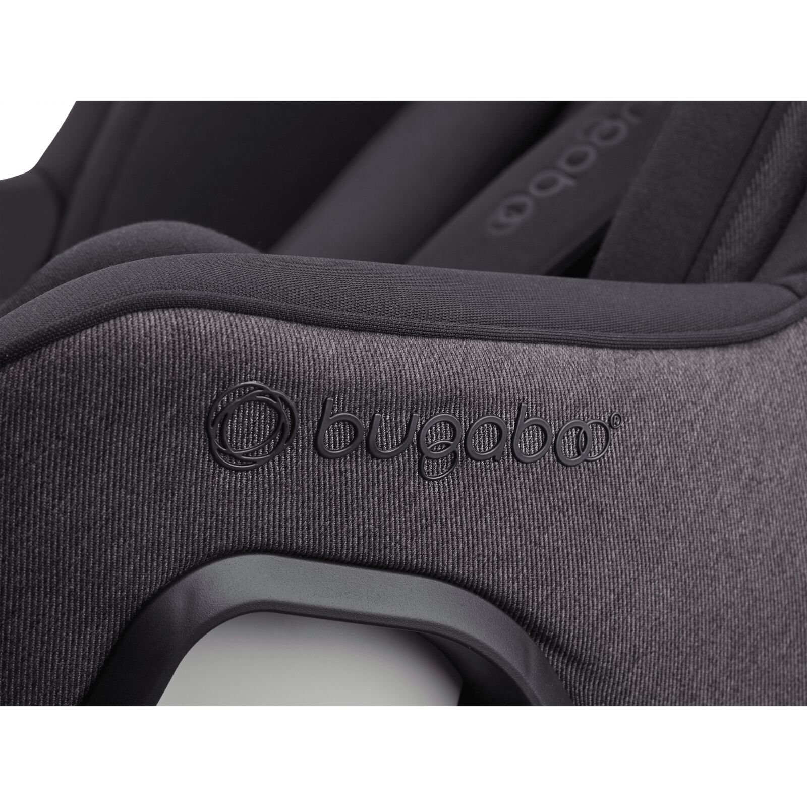 Close up of the embossed Bugaboo logo on the Bugaboo Owl by Nuna car seat in black fabrics.