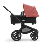 Side view of the Bugaboo Fox 5 carrycot pushchair with black chassis, midnight black fabrics and sunrise red sun canopy. - Thumbnail Slide 3 of 16