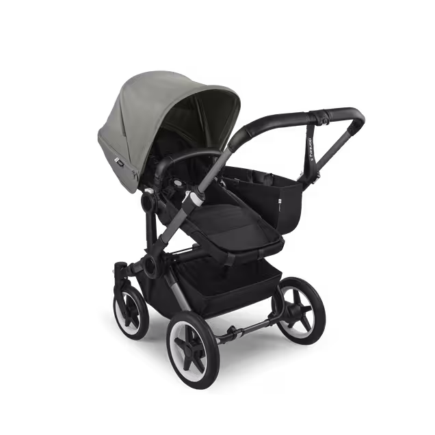 Refurbished Bugaboo Donkey 5 Mono bassinet and seat stroller graphite base, midnight black fabrics, forest green sun canopy - Main Image Slide 2 of 10