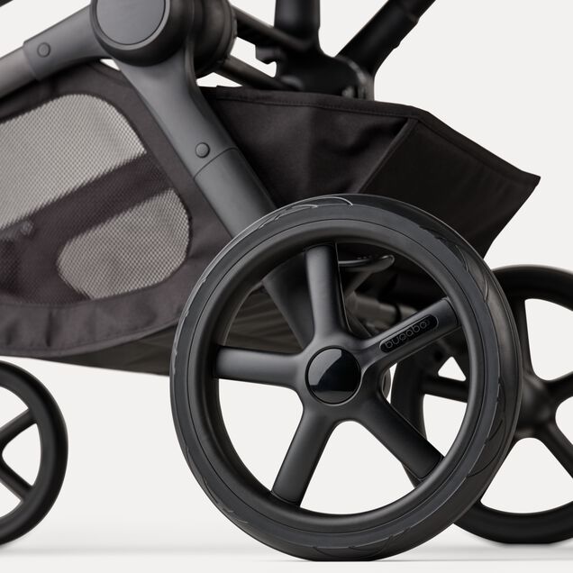 A close-up of the rear wheels and underseat basket of the Bugaboo Kangaroo 2-in-1 stroller. - Main Image Slide 14 of 18