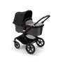 Bugaboo Fox 3 bassinet stroller with black frame, grey fabrics, and black sun canopy. - Thumbnail Slide 2 of 7