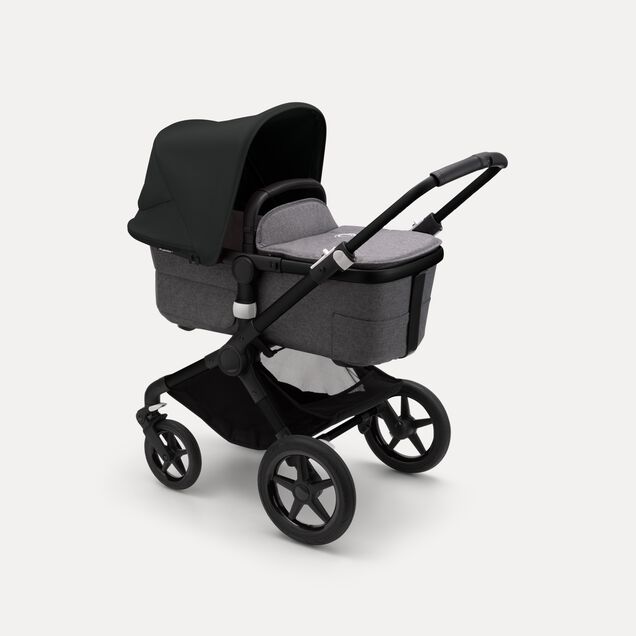Bugaboo Fox 3 bassinet stroller with black frame, grey fabrics, and black sun canopy. - Main Image Slide 2 of 7