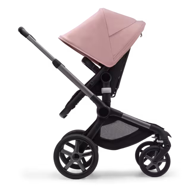 Side view of the Bugaboo Fox 5 seat pushchair with graphite chassis, midnight black fabrics and morning pink sun canopy. - Main Image Slide 3 of 13