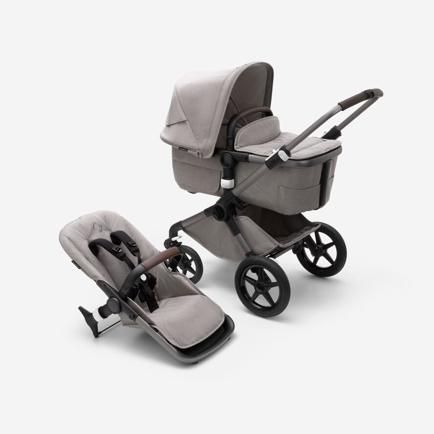 Bugaboo Fox 3 bassinet and seat stroller with graphite frame, light grey fabrics and light grey sun canopy.