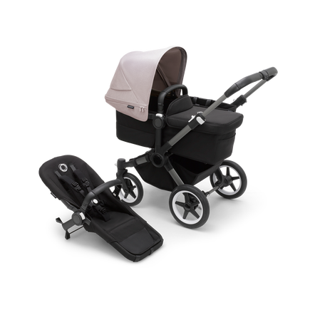 Bugaboo Donkey 5 Mono bassinet stroller with graphite chassis, midnight black fabrics and misty white sun canopy, plus seat.