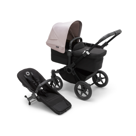 Bugaboo Donkey 5 Mono bassinet stroller with black chassis, midnight black fabrics and misty white sun canopy, plus seat.