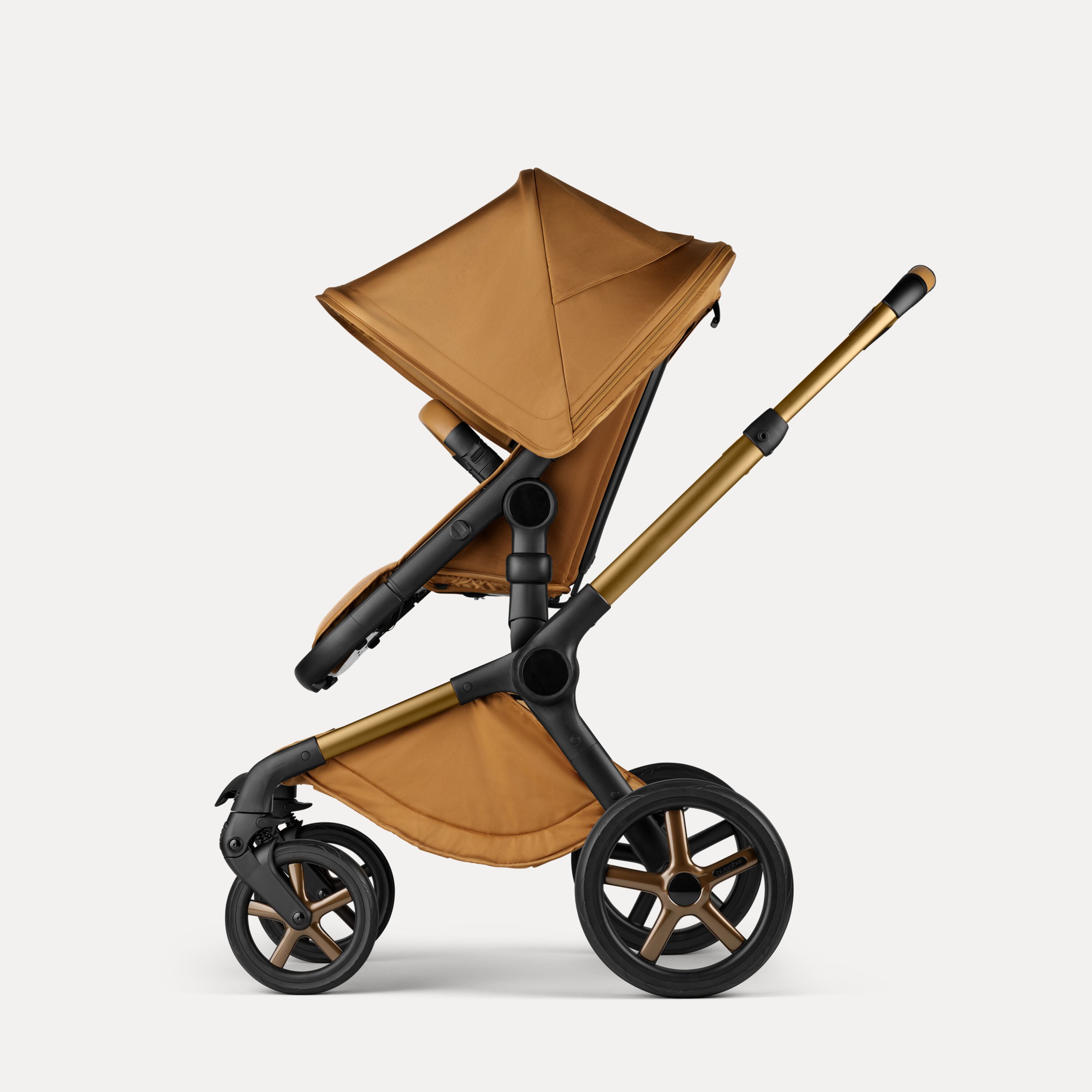 Side view of a Bugaboo Fox 5 Noir Limited Edition seat pushchair in Amber Glow colourway. - Main Modal Image Slide 4 of 15