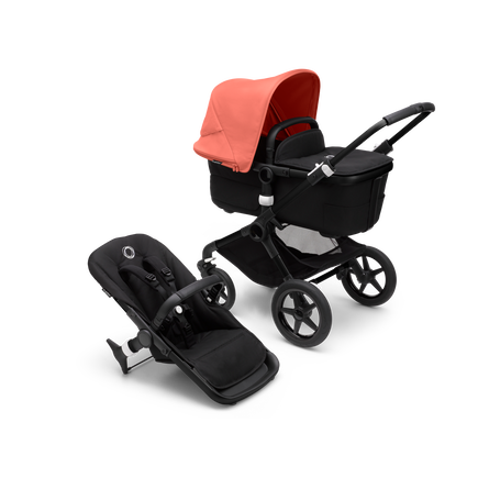 Bugaboo Fox 3 Liegewannen- und Sitz-Kinderwagen mit schwarzem Rahmen, schwarzem Stoff und rotem Sonnendach.